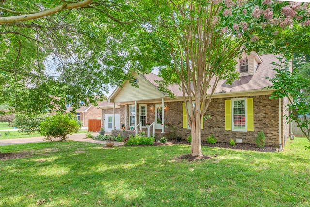 314 Millhouse Rd, Smyrna, TN 37167 - view of front of home featuring a front yard, brick siding, a shingled roof, and a porch