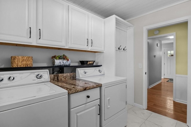 346 Spring Creek Ln, Lebanon, TN 37090 - laundry area with washer and clothes dryer, cabinet space, light marble finish flooring, and baseboards