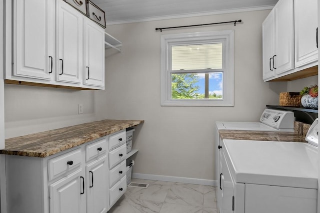 346 Spring Creek Ln, Lebanon, TN 37090 - washroom featuring washing machine and dryer, cabinet space, light marble finish floors, baseboards, and ornamental molding
