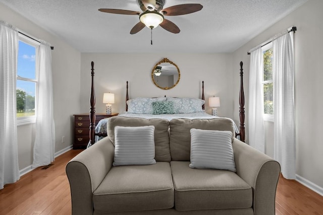 346 Spring Creek Ln, Lebanon, TN 37090 - bedroom with light wood-style floors, baseboards, a ceiling fan, and a textured ceiling