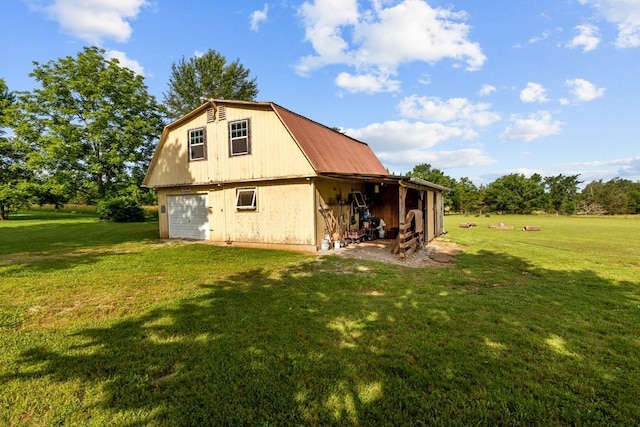 346 Spring Creek Ln, Lebanon, TN 37090 - back of property featuring a garage, a gambrel roof, a lawn, and metal roof