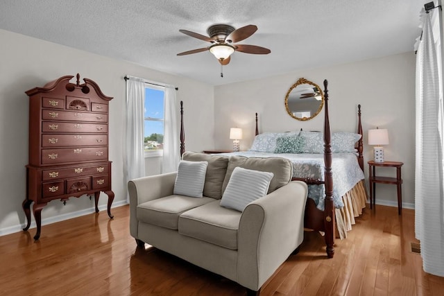 346 Spring Creek Ln, Lebanon, TN 37090 - bedroom featuring light wood-style flooring, ceiling fan, a textured ceiling, and baseboards