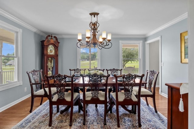 346 Spring Creek Ln, Lebanon, TN 37090 - dining space with a chandelier, ornamental molding, wood finished floors, and baseboards