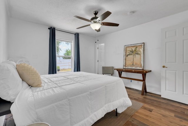 1921 Timberline Cir, Oak Grove, KY 42262 - bedroom featuring wood finished floors, a textured ceiling, ceiling fan, and baseboards