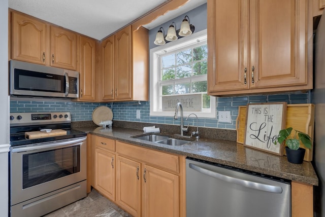 1921 Timberline Cir, Oak Grove, KY 42262 - kitchen with stainless steel appliances, a sink, backsplash, and dark stone countertops
