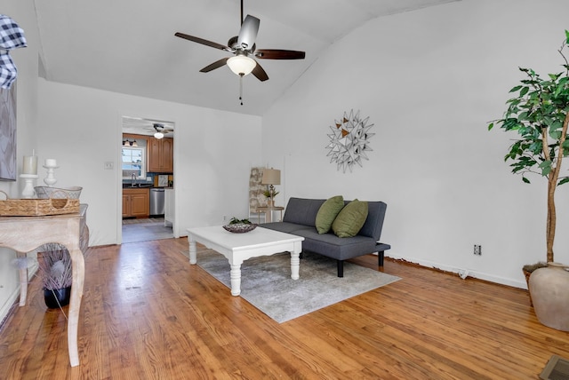 1921 Timberline Cir, Oak Grove, KY 42262 - living area with vaulted ceiling, ceiling fan, light wood finished floors, and baseboards