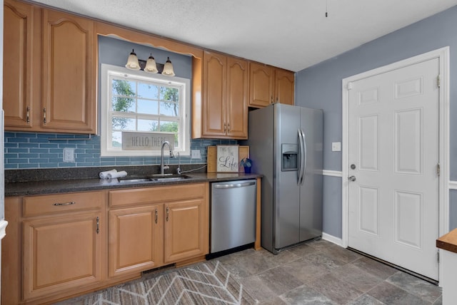 1921 Timberline Cir, Oak Grove, KY 42262 - kitchen with appliances with stainless steel finishes, a sink, decorative backsplash, baseboards, and stone finish flooring