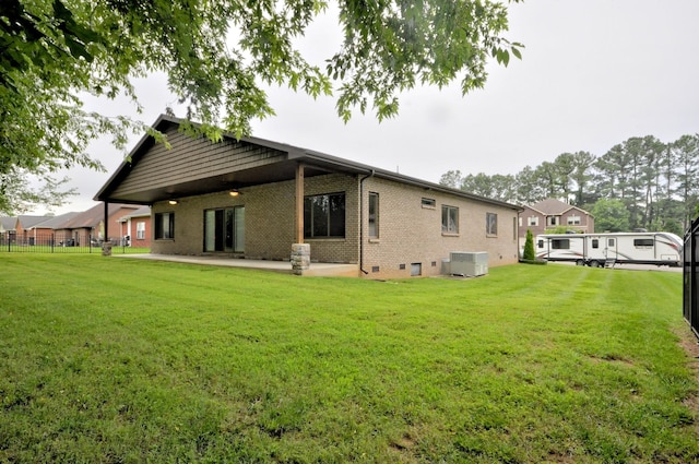 3173 Porter Hills Dr, Clarksville, TN 37043 - back of property with central AC unit, a patio, and brick siding