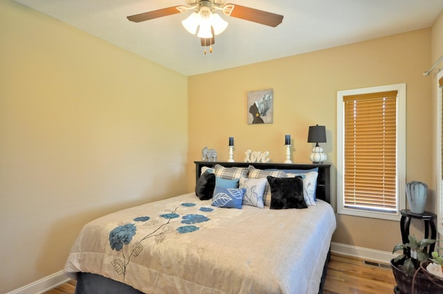 3173 Porter Hills Dr, Clarksville, TN 37043 - bedroom with wood finished floors, baseboards, and a ceiling fan