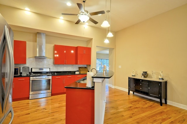 3173 Porter Hills Dr, Clarksville, TN 37043 - kitchen with red cabinetry, stainless steel appliances, wall chimney range hood, light wood-type flooring, and recessed lighting