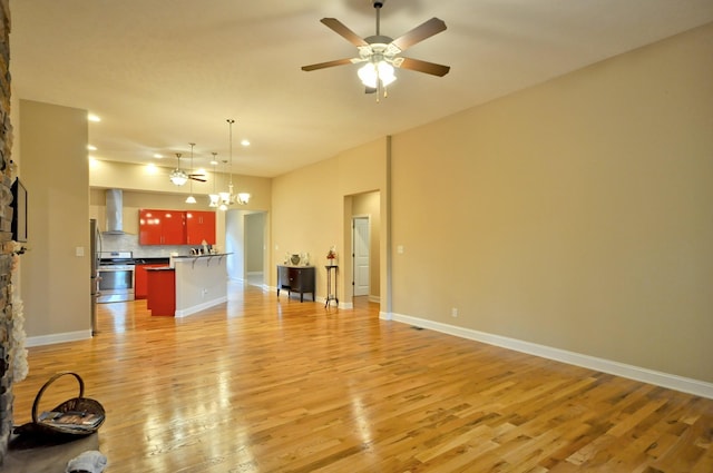 3173 Porter Hills Dr, Clarksville, TN 37043 - unfurnished living room with light wood finished floors, ceiling fan, a chandelier, baseboards, and a fireplace