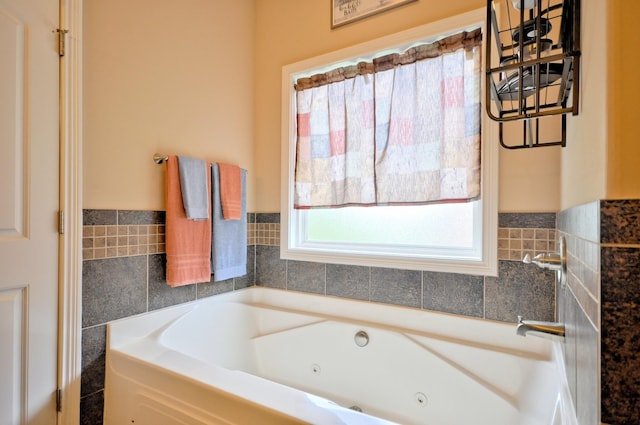 3173 Porter Hills Dr, Clarksville, TN 37043 - bathroom featuring a whirlpool tub and tile walls