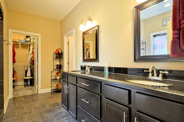 3173 Porter Hills Dr, Clarksville, TN 37043 - full bathroom featuring double vanity, a spacious closet, and tile patterned flooring