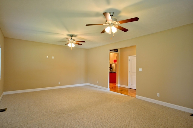 3173 Porter Hills Dr, Clarksville, TN 37043 - empty room with light colored carpet, ceiling fan, and baseboards