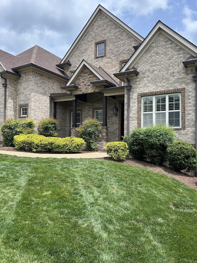 2040 Brisbane Dr, Spring Hill, TN 37174 - view of front of home with brick siding and a front lawn