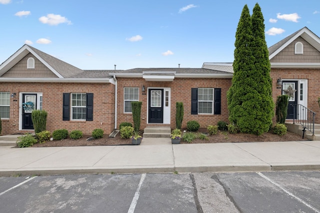 1101 Downs Blvd Unit 295, Franklin, TN 37064 - view of front of house featuring brick siding and uncovered parking
