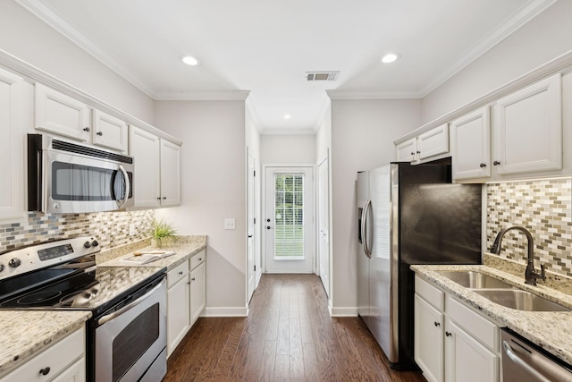 1101 Downs Blvd Unit 295, Franklin, TN 37064 - kitchen with appliances with stainless steel finishes, a sink, white cabinetry, dark wood-style floors, and decorative backsplash