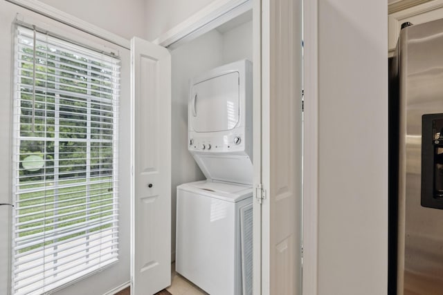 1101 Downs Blvd Unit 295, Franklin, TN 37064 - laundry room with stacked washer / drying machine and light tile patterned flooring