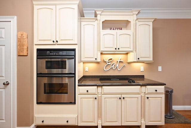 1043 Dorset Dr, Hendersonville, TN 37075 - kitchen featuring stainless steel double oven, cream cabinets, black electric cooktop, and dark countertops