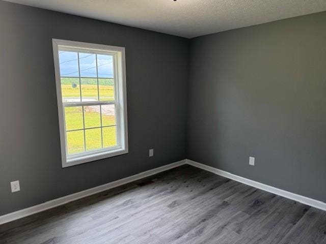 406 New Rock Creek Rd, Tullahoma, TN 37388 - empty room with dark wood-type flooring and baseboards