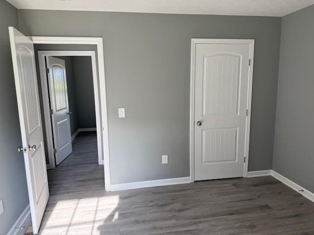 406 New Rock Creek Rd, Tullahoma, TN 37388 - unfurnished bedroom with wood finished floors and baseboards