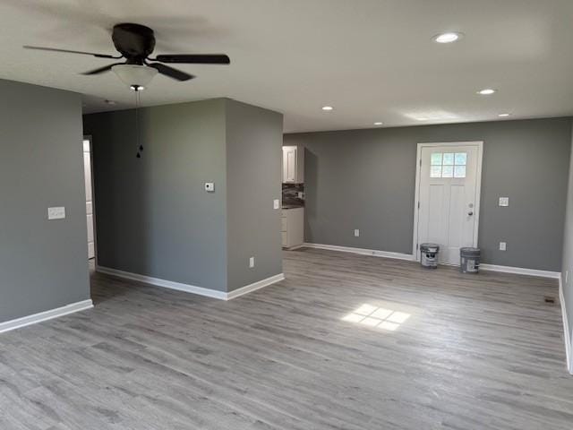 406 New Rock Creek Rd, Tullahoma, TN 37388 - unfurnished living room featuring a ceiling fan, baseboards, wood finished floors, and recessed lighting