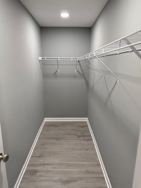 406 New Rock Creek Rd, Tullahoma, TN 37388 - walk in closet with wood finished floors