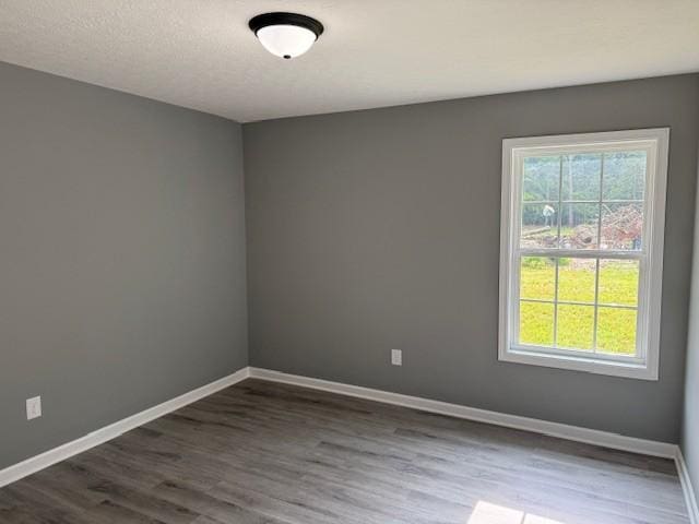 406 New Rock Creek Rd, Tullahoma, TN 37388 - empty room with dark wood-style flooring and baseboards