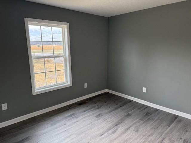 406 New Rock Creek Rd, Tullahoma, TN 37388 - unfurnished room featuring dark wood-type flooring and baseboards