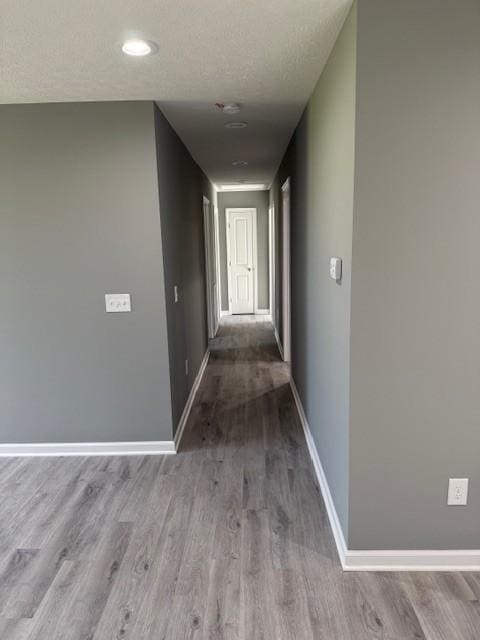 406 New Rock Creek Rd, Tullahoma, TN 37388 - corridor featuring baseboards, wood finished floors, and a textured ceiling