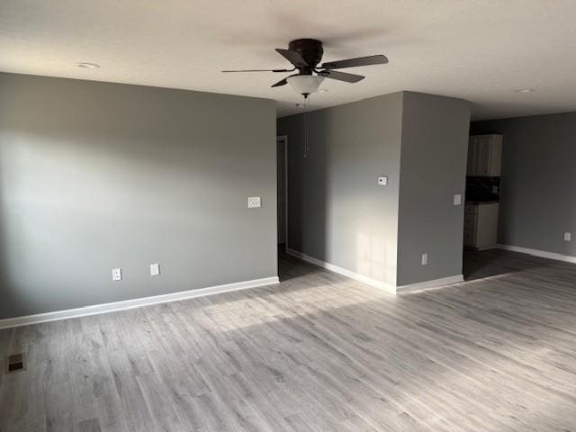 406 New Rock Creek Rd, Tullahoma, TN 37388 - unfurnished room with a ceiling fan, wood finished floors, and baseboards