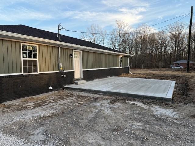 406 New Rock Creek Rd, Tullahoma, TN 37388 - view of front of property featuring board and batten siding and brick siding