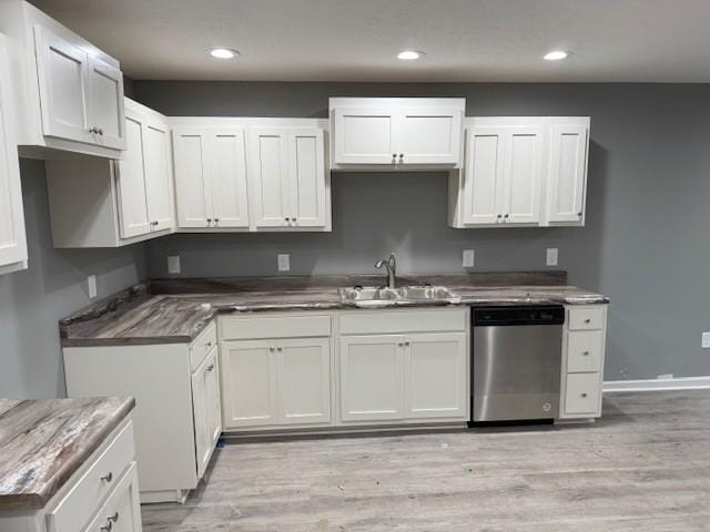 406 New Rock Creek Rd, Tullahoma, TN 37388 - kitchen featuring dishwasher, a sink, light wood-style floors, recessed lighting, and white cabinets