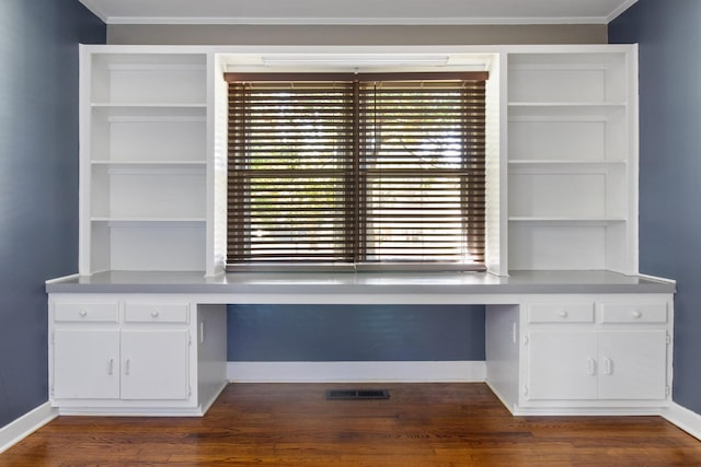 608 Bragg Cir, Tullahoma, TN 37388 - unfurnished office with built in desk, baseboards, dark wood-style floors, and crown molding