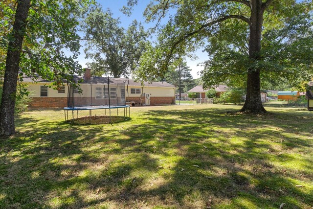 608 Bragg Cir, Tullahoma, TN 37388 - view of yard with a trampoline