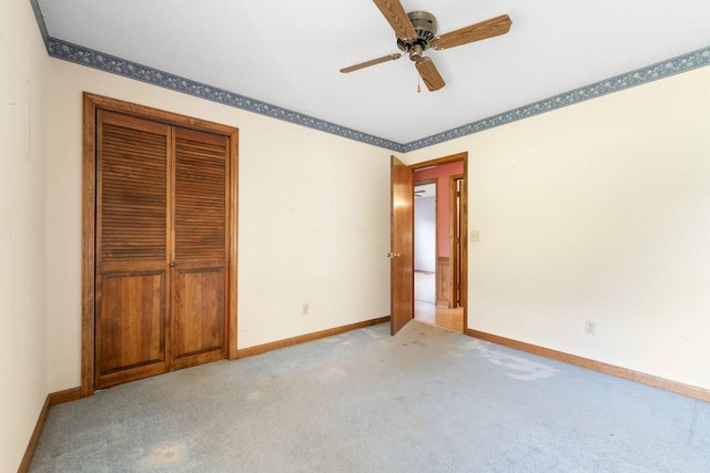 366 Huffman Park Rd, Lynchburg, TN 37352 - unfurnished bedroom featuring baseboards, light carpet, a closet, and ceiling fan
