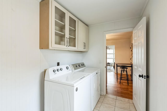 3622 Sabre Dr, Nashville, TN 37211 - laundry room featuring washing machine and dryer, cabinet space, and light tile patterned floors