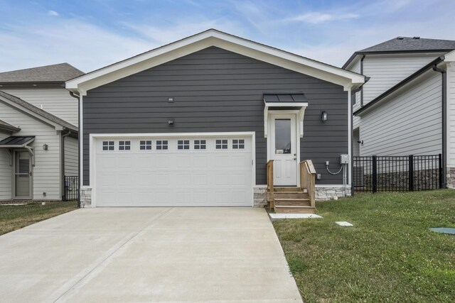 7111 Frances St, Fairview, TN 37062 - view of front of house with entry steps, concrete driveway, a garage, and stone siding
