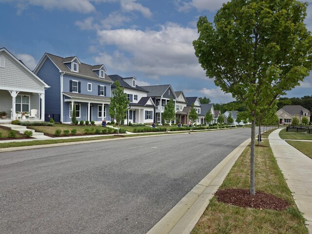 7111 Frances St, Fairview, TN 37062 - view of asphalt road featuring sidewalks, a residential view, and curbs
