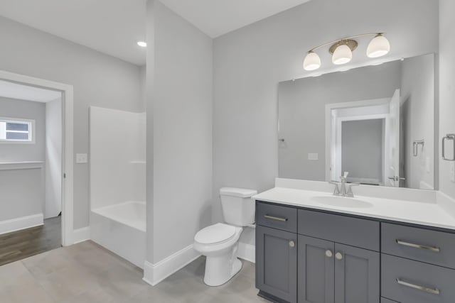 7111 Frances St, Fairview, TN 37062 - full bathroom featuring vanity, toilet, baseboards, and washtub / shower combination