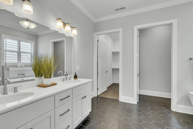 7111 Frances St, Fairview, TN 37062 - full bathroom with double vanity, ornamental molding, a soaking tub, baseboards, and tile patterned flooring