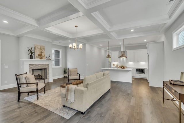 7111 Frances St, Fairview, TN 37062 - living room featuring coffered ceiling, a stone fireplace, beamed ceiling, dark wood finished floors, and a chandelier