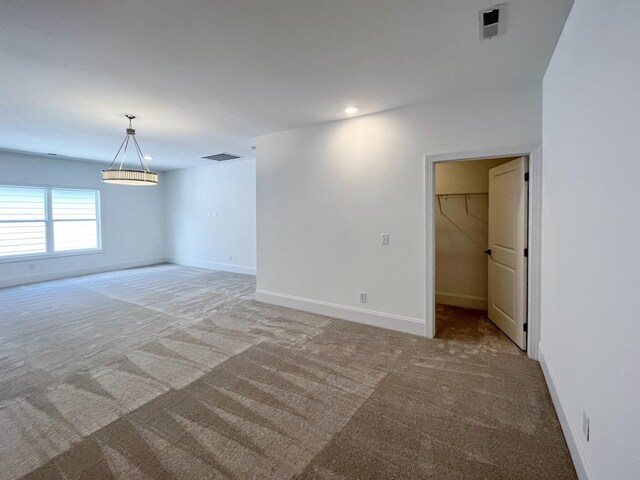 7115 Frances St, Fairview, TN 37062 - empty room featuring light colored carpet, baseboards, and a chandelier