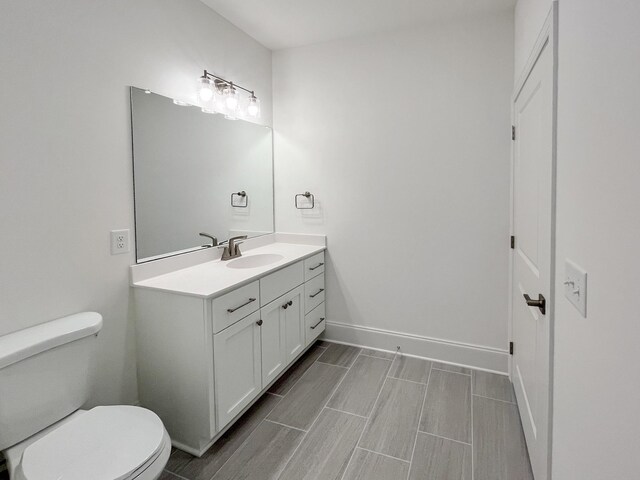 7115 Frances St, Fairview, TN 37062 - bathroom with toilet, vanity, and baseboards
