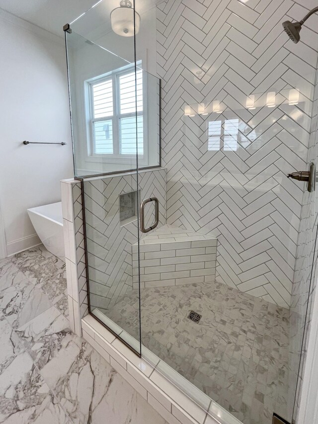 7115 Frances St, Fairview, TN 37062 - full bath featuring a shower stall, a freestanding tub, marble finish flooring, crown molding, and baseboards