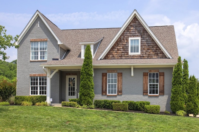 6575 Windmill Dr, College Grove, TN 37046 - view of front of property with a shingled roof, brick siding, and a front lawn