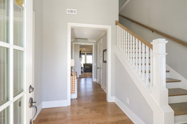 6575 Windmill Dr, College Grove, TN 37046 - foyer entrance featuring light wood-style flooring, baseboards, and stairway