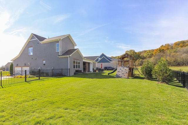 6575 Windmill Dr, College Grove, TN 37046 - rear view of house with a playground and an attached garage