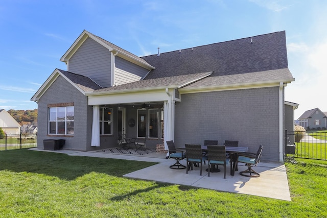 6575 Windmill Dr, College Grove, TN 37046 - back of house with a patio area, brick siding, and a shingled roof