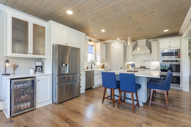 6575 Windmill Dr, College Grove, TN 37046 - kitchen with appliances with stainless steel finishes, wine cooler, custom exhaust hood, wood ceiling, and recessed lighting